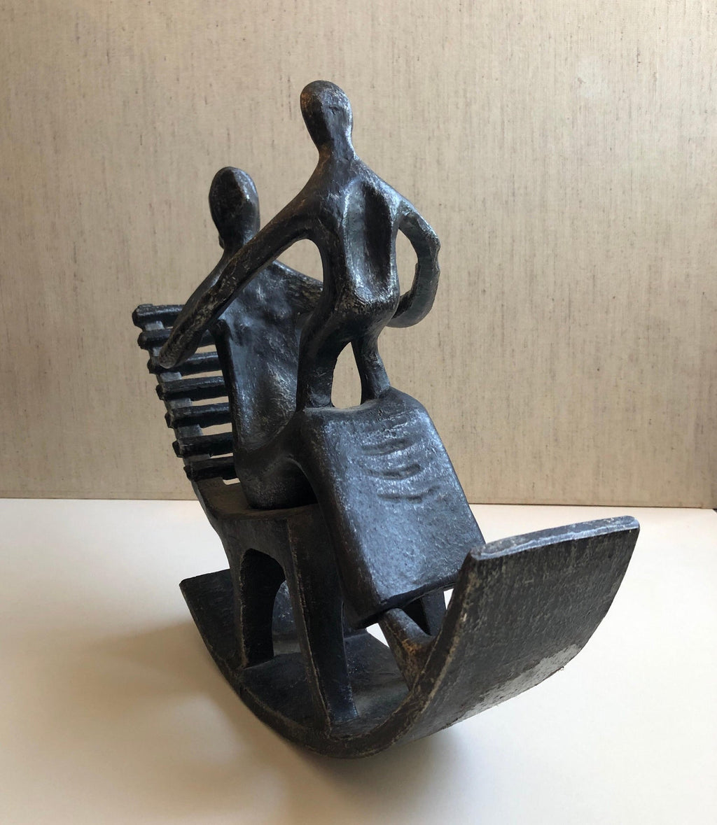 In the style of Henry Moore, Mother and Child in Rocking Chair