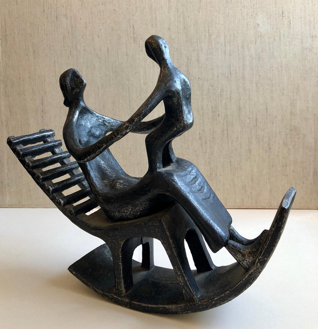 In the style of Henry Moore, Mother and Child in Rocking Chair