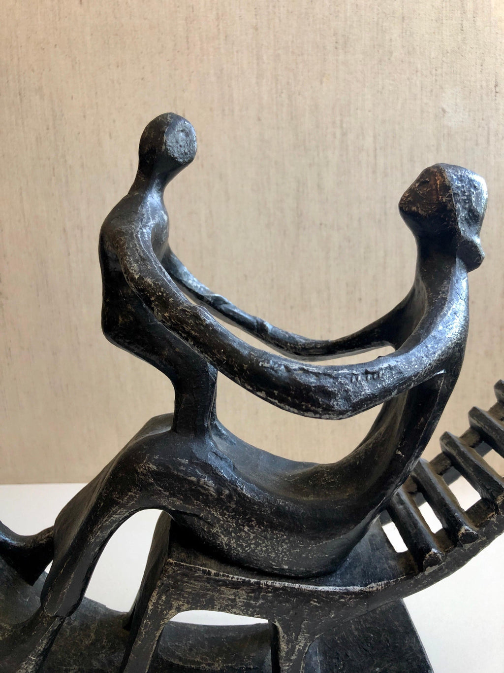 In the style of Henry Moore, Mother and Child in Rocking Chair