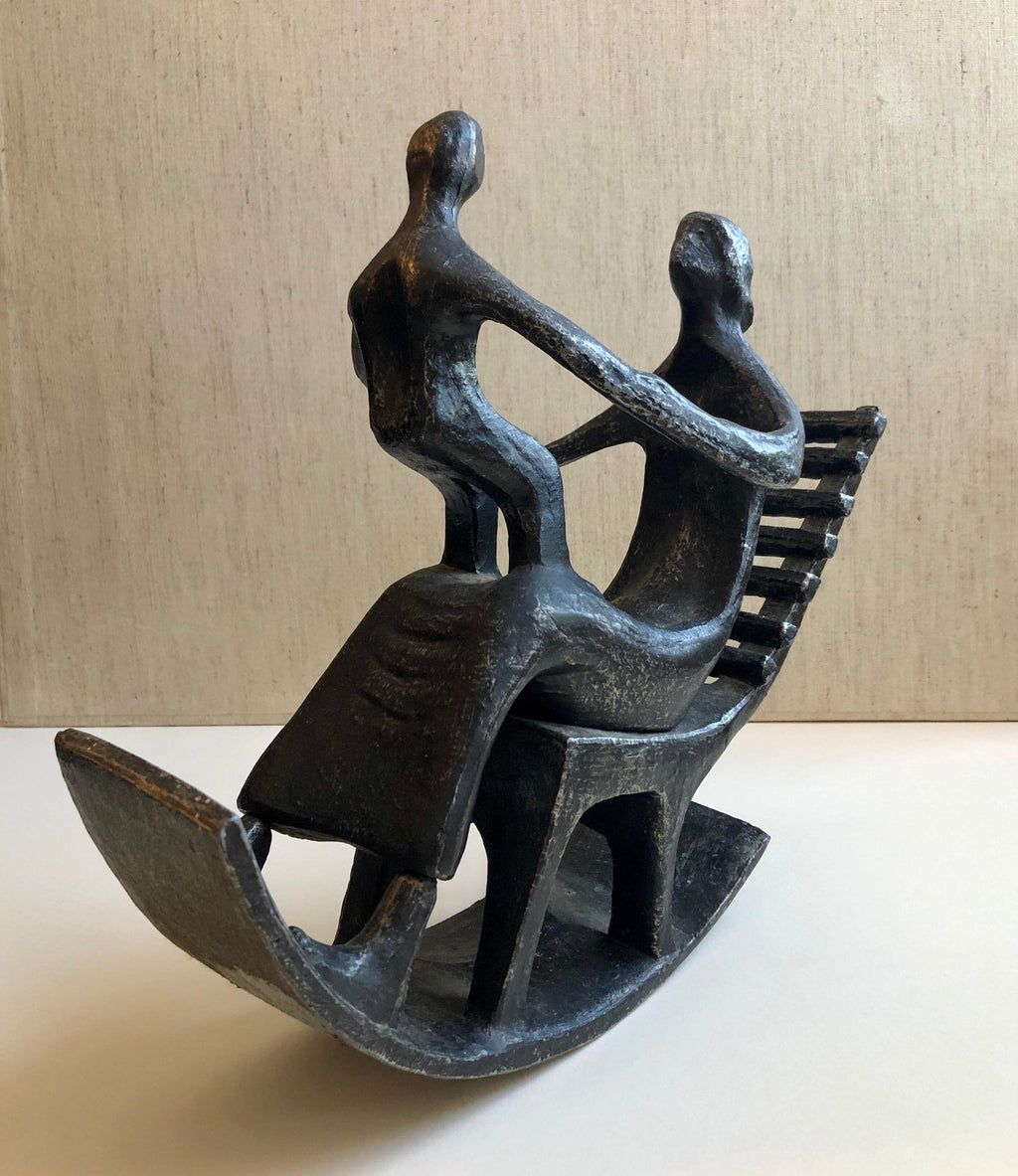 In the style of Henry Moore, Mother and Child in Rocking Chair
