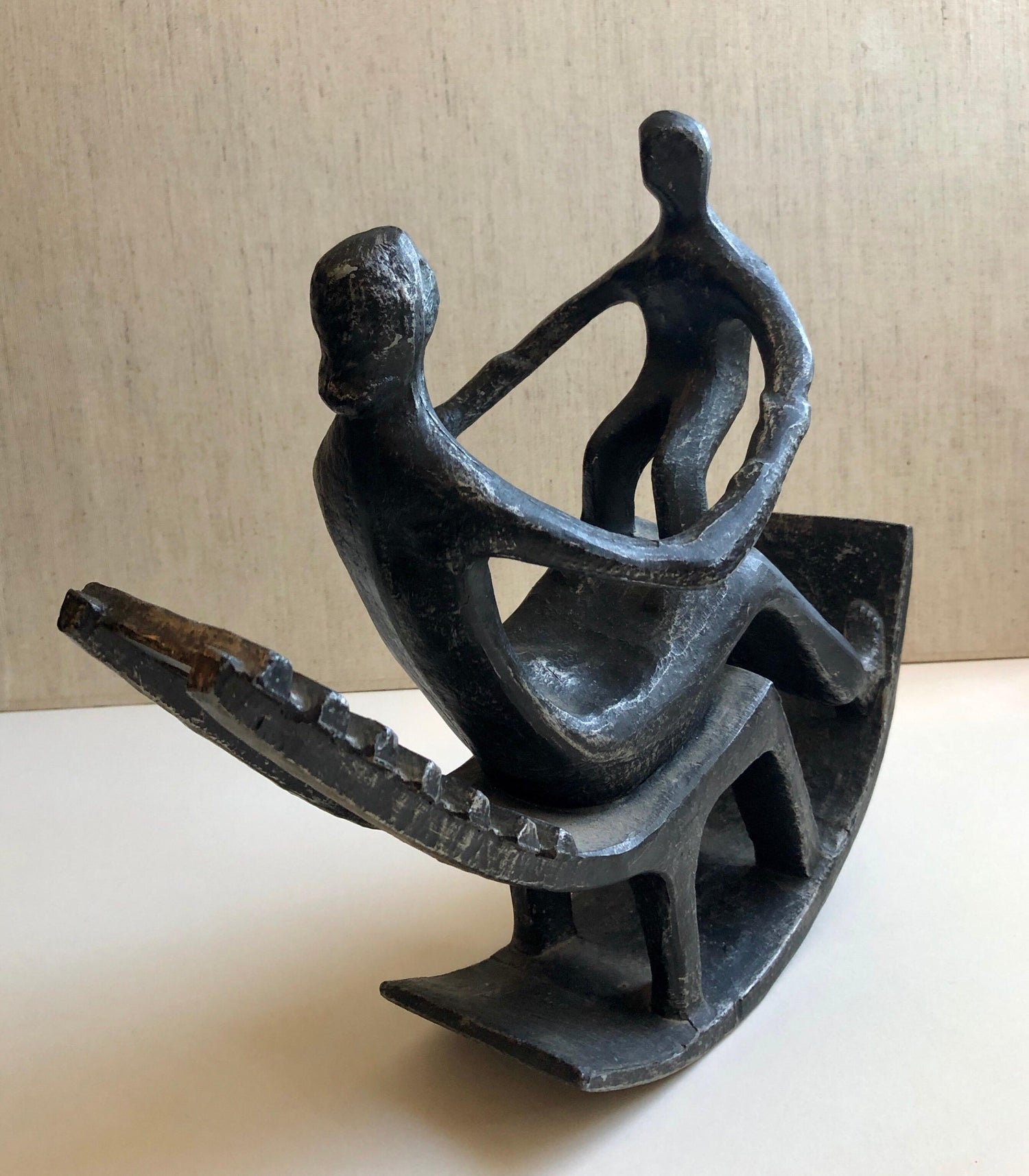 In the style of Henry Moore, Mother and Child in Rocking Chair